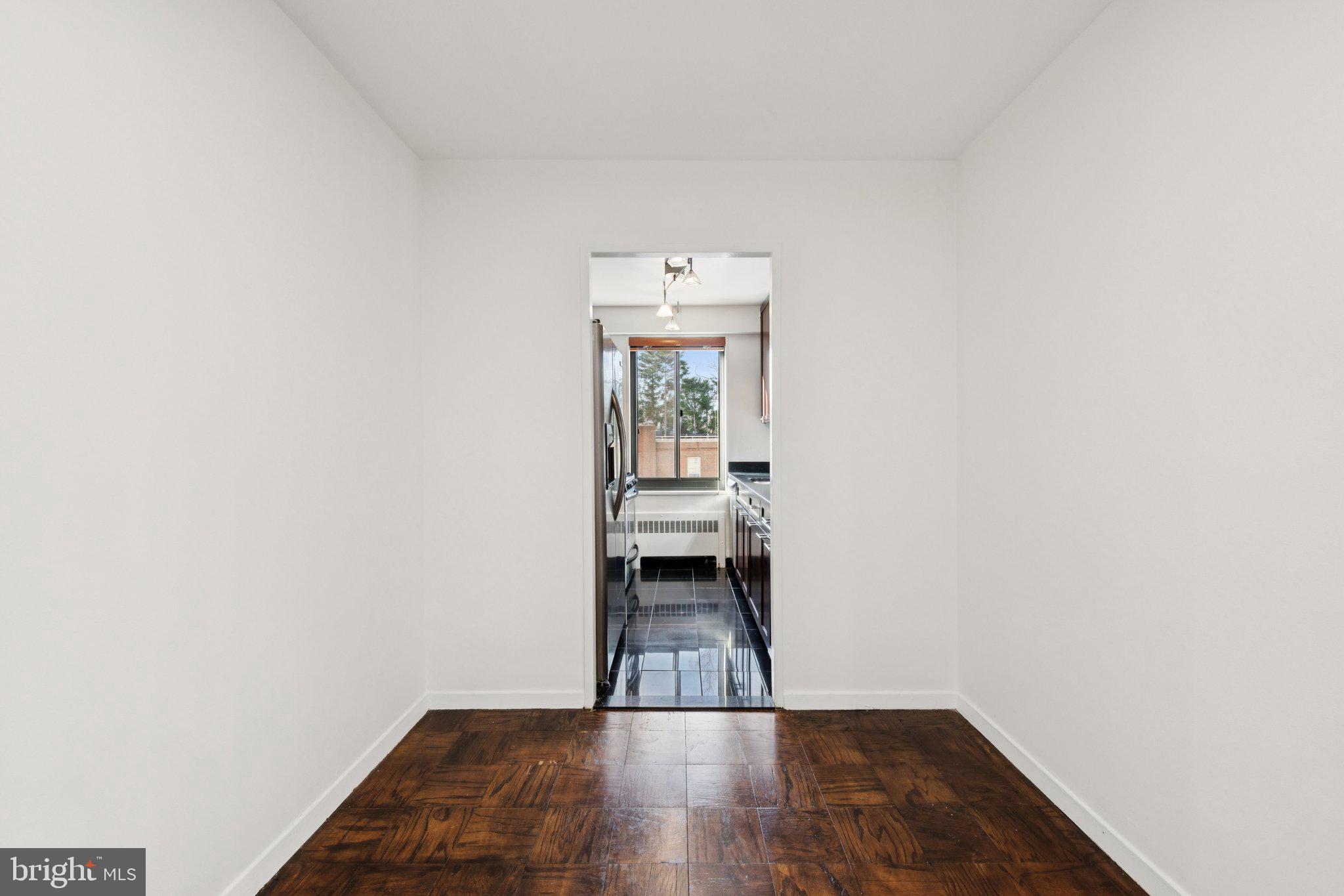 5410 Connecticut Avenue Northwest, Unit 315 Washington, DC 20015 - Photo 13 of 22 a view of a room with wooden floor and window
