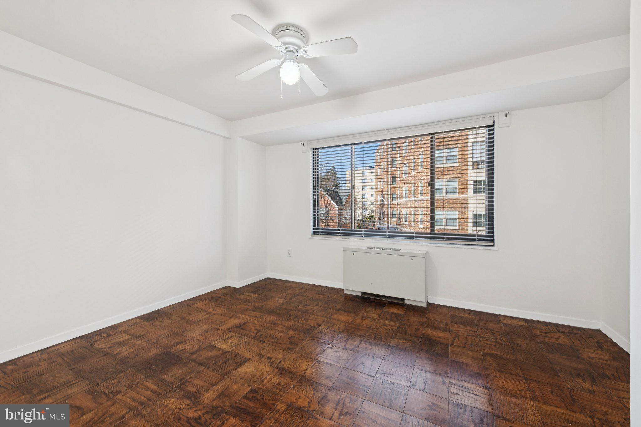 5410 Connecticut Avenue Northwest, Unit 315 Washington, DC 20015 - Photo 14 of 22 an empty room with windows and fan