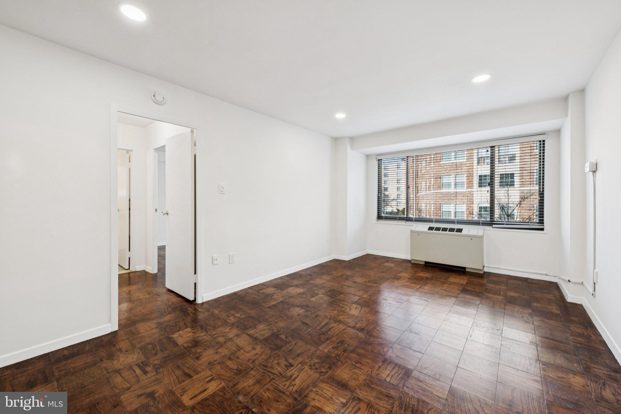 5410 Connecticut Avenue Northwest, Unit 315 Washington, DC 20015 - Photo 7 of 22 an empty room with windows and entrance