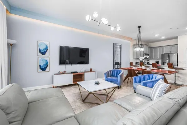 a living room with furniture and a flat screen tv