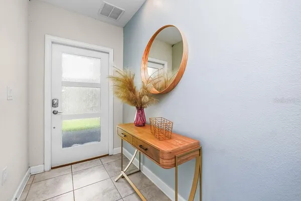 a bathroom with a sink a mirror and a shower