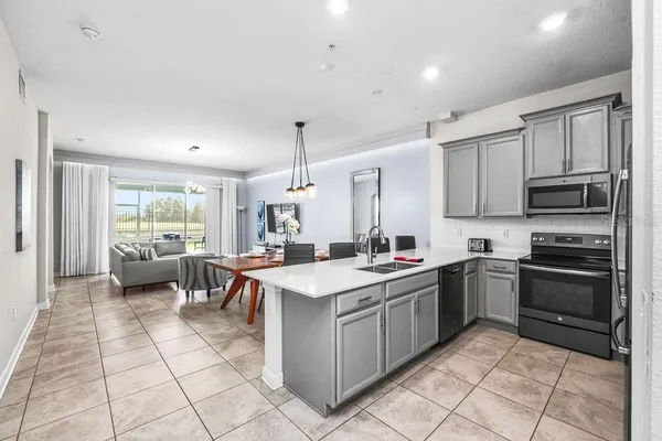 a kitchen with a sink stove and cabinets