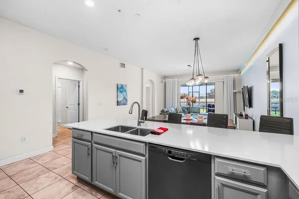 a kitchen with sink and cabinets