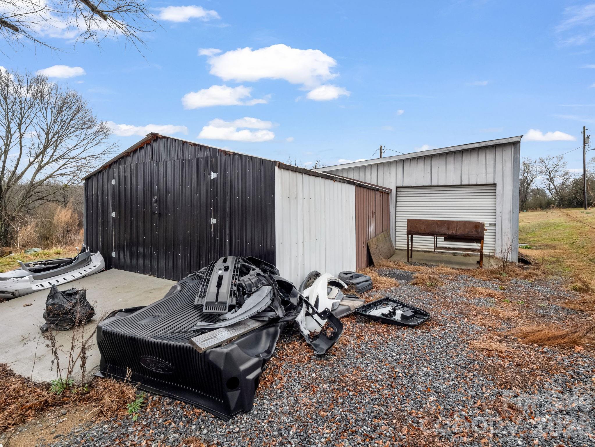 827 Old Henrietta Road Forest City, NC 28043 - Photo 9 of 22 a backyard of a house with barbeque oven table and chairs