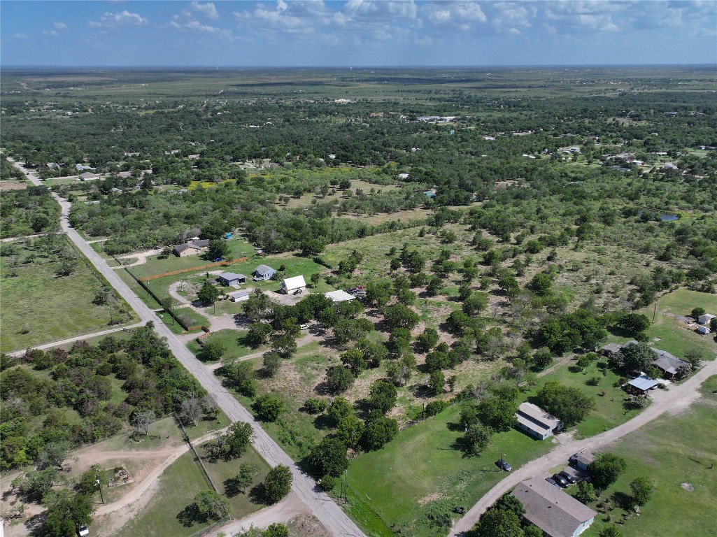 983 Long Hollow Road Dale, TX 78616 - Photo 3 of 8 an aerial view of residential houses with outdoor space and trees