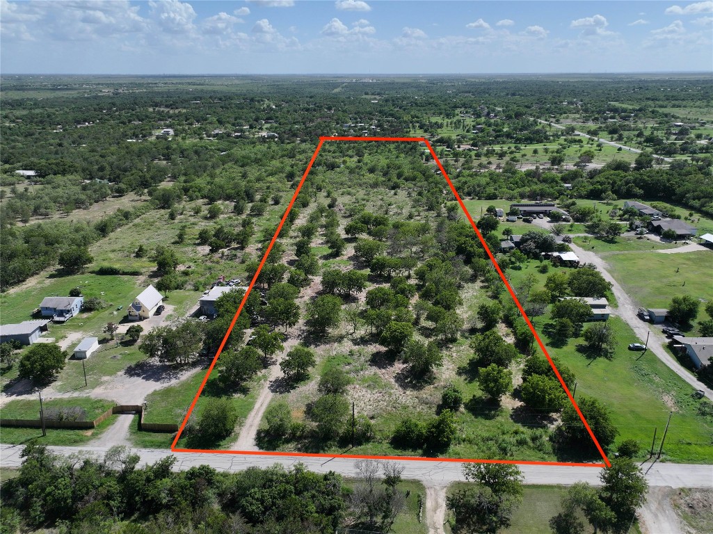 983 Long Hollow Road Dale, TX 78616 - Photo 7 of 8 an aerial view of residential houses with outdoor space and trees