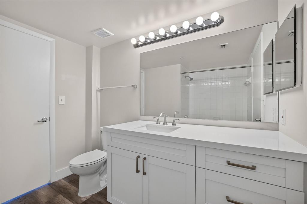 3020 Northeast 32nd Avenue, Unit 1207 Fort Lauderdale, FL 33308 - Photo 13 of 69 a bathroom with a sink a toilet and a mirror
