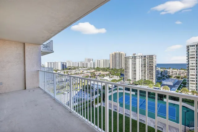 a living room with furniture and potted plant