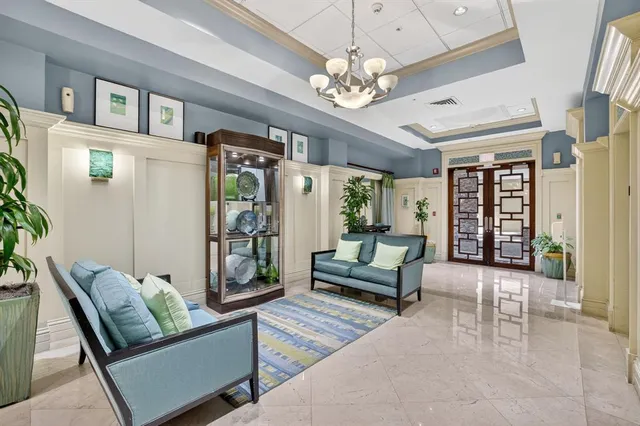 a kitchen with a table chairs sink and cabinets