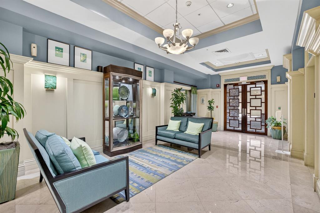 3020 Northeast 32nd Avenue, Unit 1207 Fort Lauderdale, FL 33308 - Photo 30 of 69 a living room with furniture and a chandelier