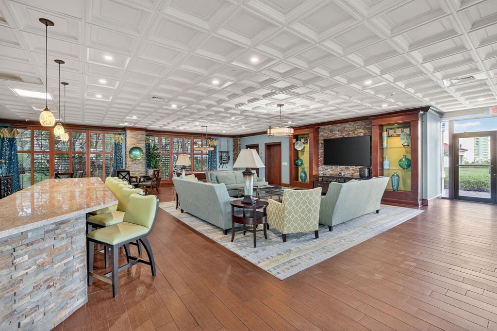 3020 Northeast 32nd Avenue, Unit 1207 Fort Lauderdale, FL 33308 - Photo 36 of 69 a living room with fireplace furniture and a wooden floor