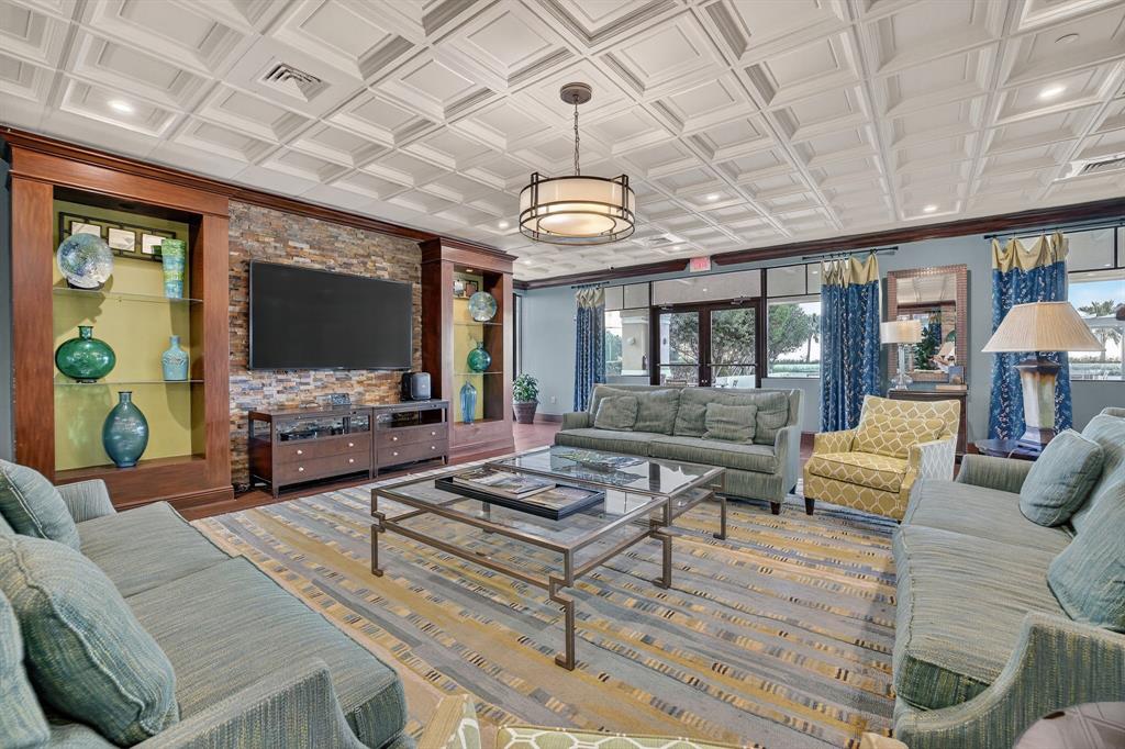 3020 Northeast 32nd Avenue, Unit 1207 Fort Lauderdale, FL 33308 - Photo 39 of 69 a living room with furniture and a chandelier