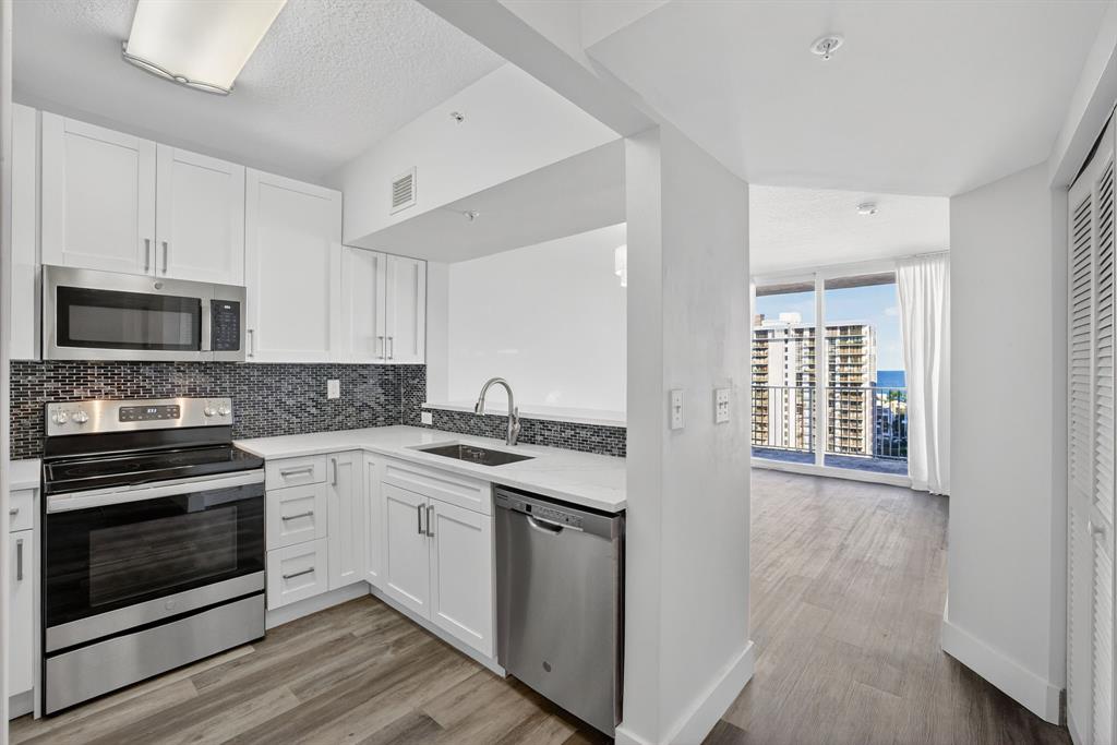 3020 Northeast 32nd Avenue, Unit 1207 Fort Lauderdale, FL 33308 - Photo 4 of 69 a kitchen with stainless steel appliances granite countertop a stove and a sink