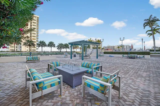 a view of swimming pool with outdoor seating