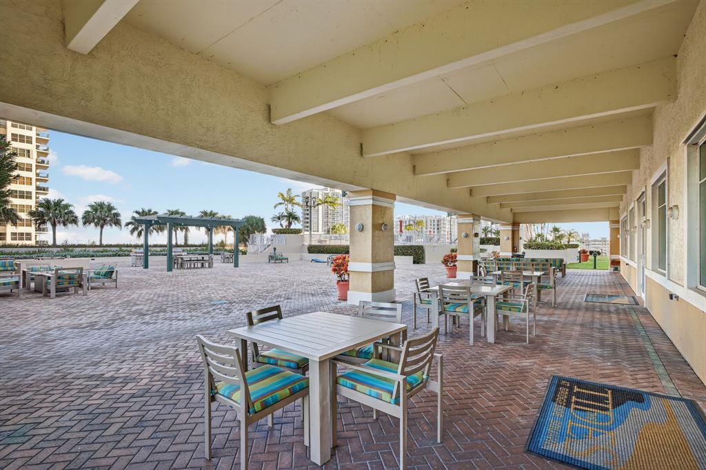 3020 Northeast 32nd Avenue, Unit 1207 Fort Lauderdale, FL 33308 - Photo 45 of 69 a outdoor space with lots of furniture and glass door