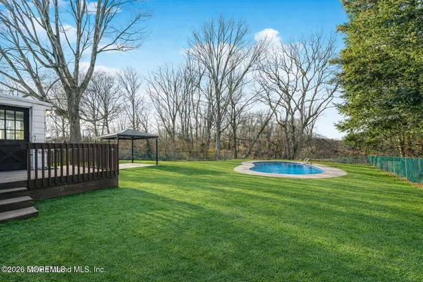 a view of a park with large trees
