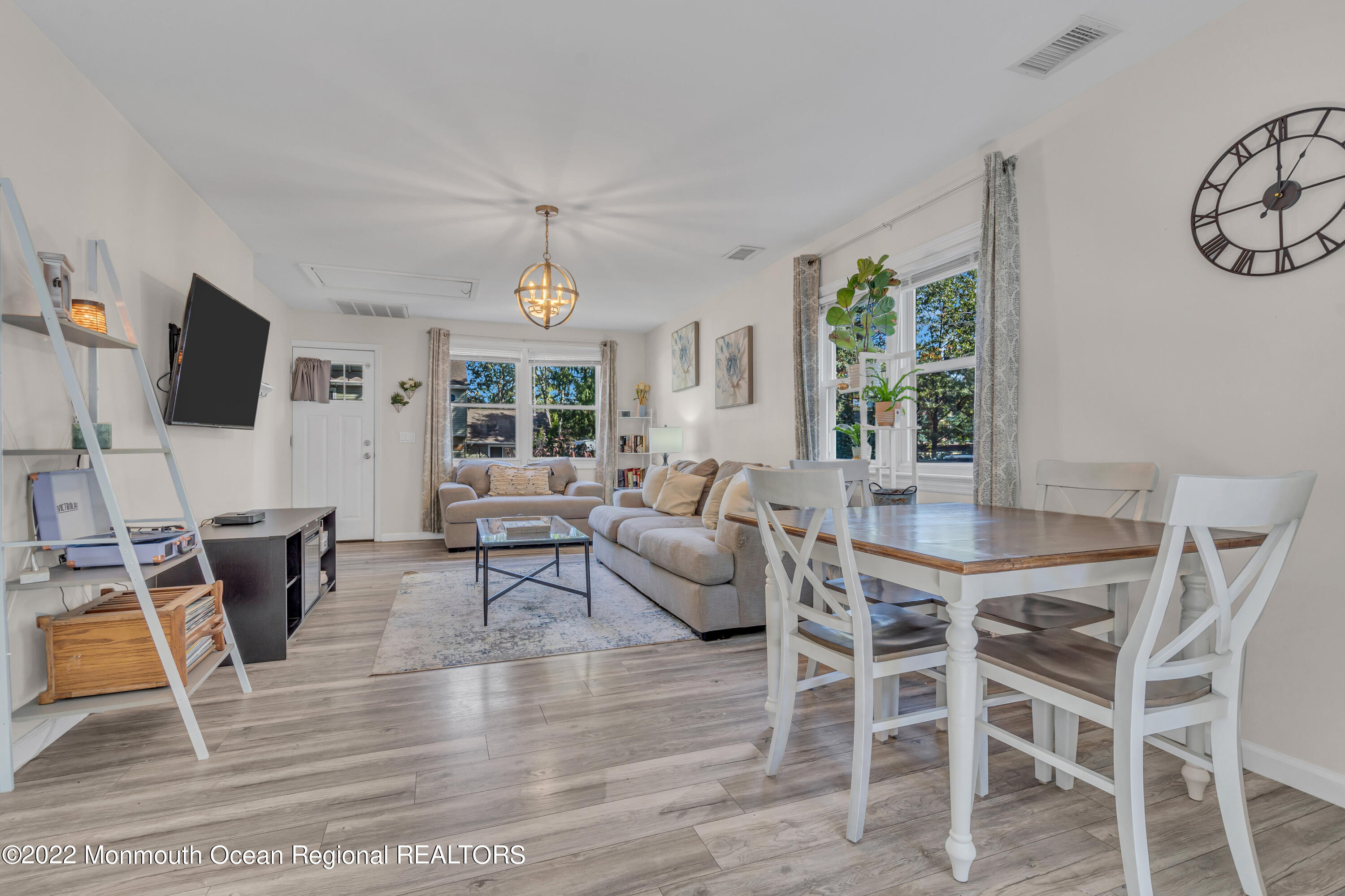 176 Pinehurst Road Brick, NJ 08723 - Photo 13 of 55 a living room with furniture a flat screen tv and a large window