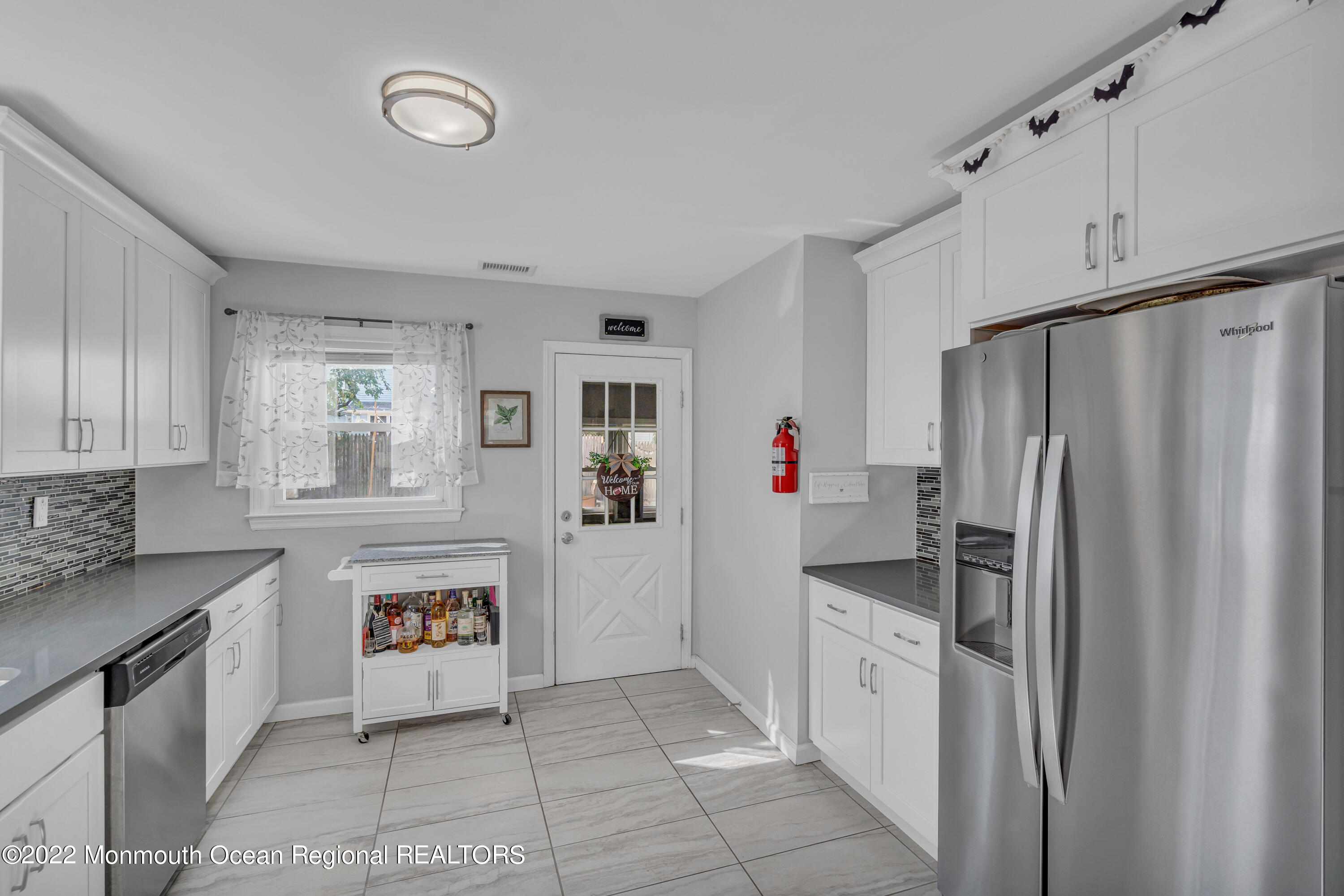 176 Pinehurst Road Brick, NJ 08723 - Photo 17 of 55 a kitchen with a refrigerator and a sink