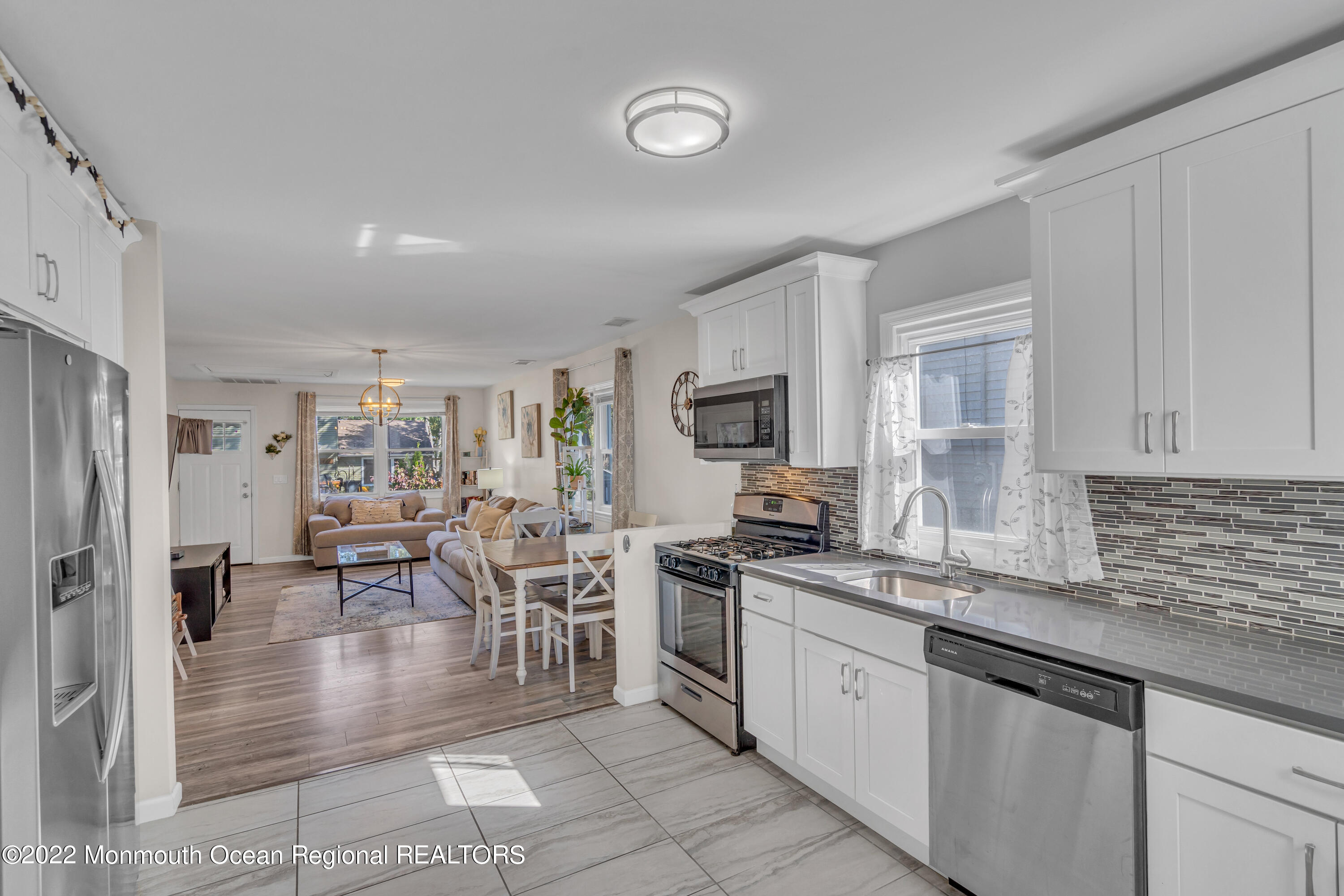 176 Pinehurst Road Brick, NJ 08723 - Photo 19 of 55 a kitchen with stainless steel appliances granite countertop a refrigerator stove microwave and sink
