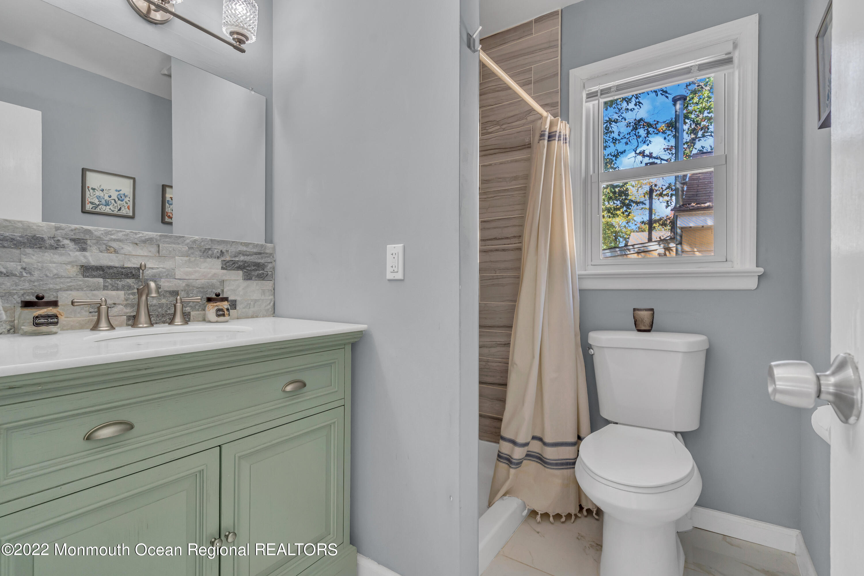 176 Pinehurst Road Brick, NJ 08723 - Photo 20 of 55 a bathroom with a toilet a sink and mirror