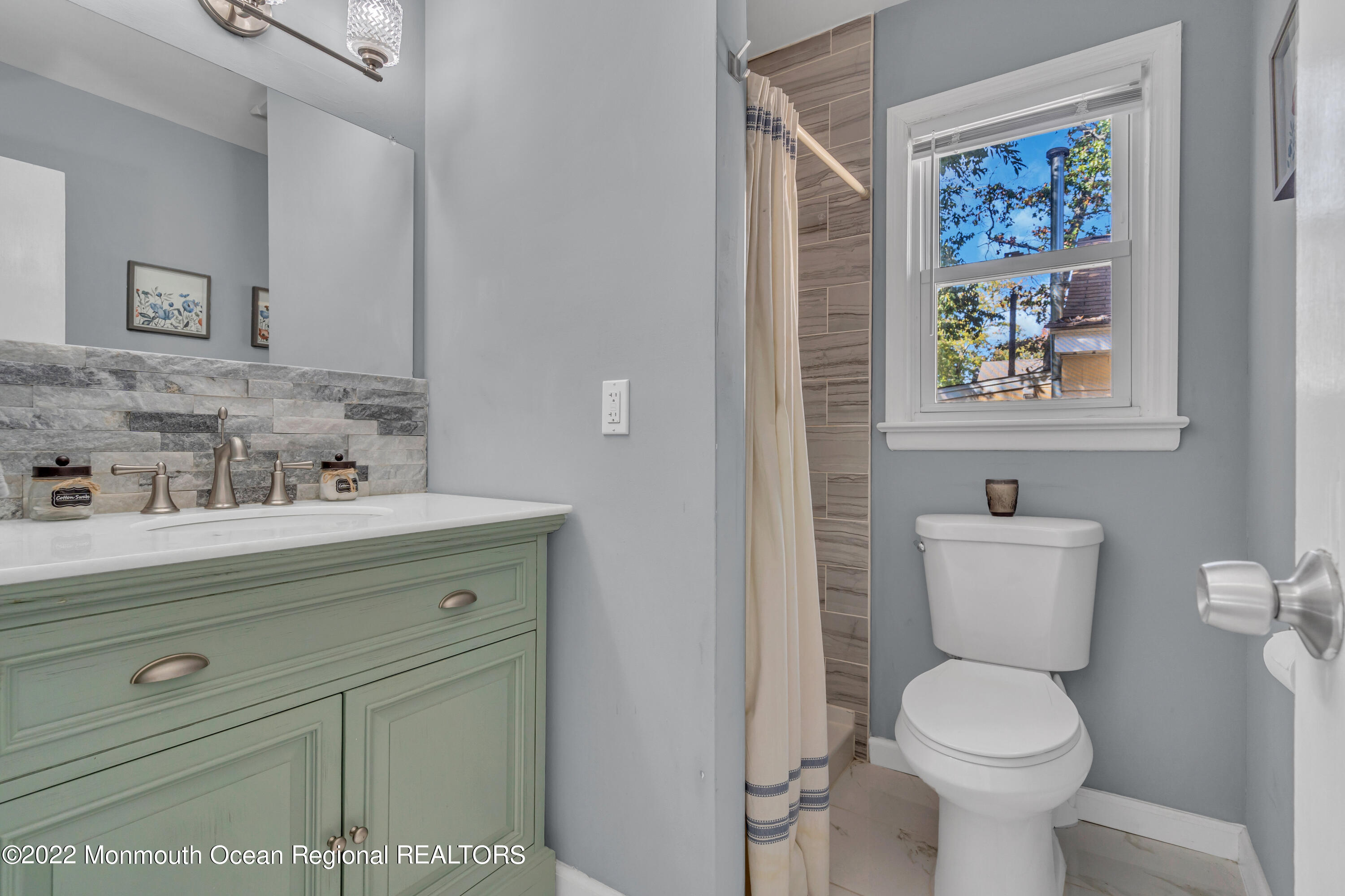 176 Pinehurst Road Brick, NJ 08723 - Photo 21 of 55 a bathroom with a toilet a sink and mirror