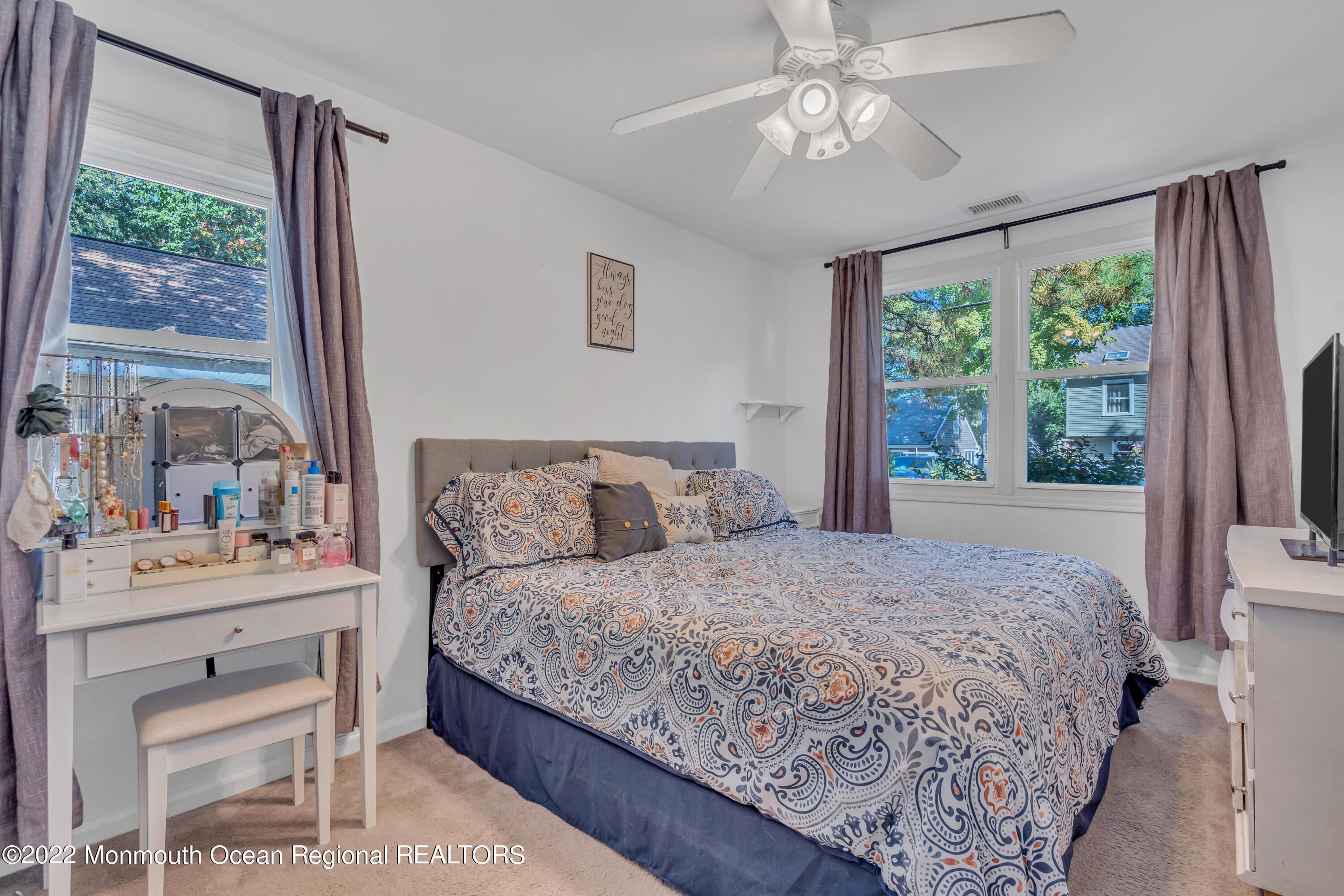 176 Pinehurst Road Brick, NJ 08723 - Photo 31 of 55 a bedroom with a large bed and a chandelier fan