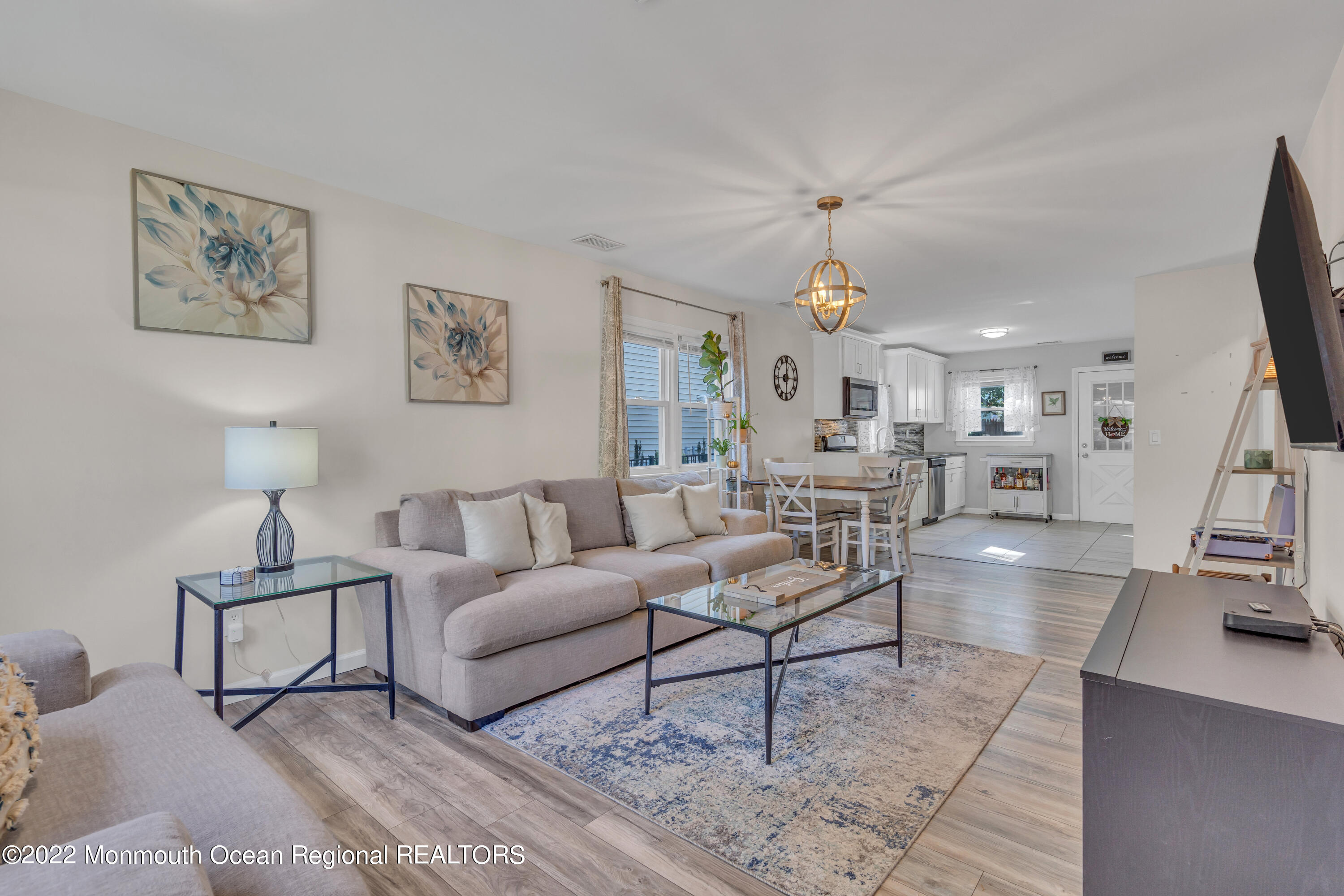 176 Pinehurst Road Brick, NJ 08723 - Photo 6 of 55 a living room with furniture and a chandelier