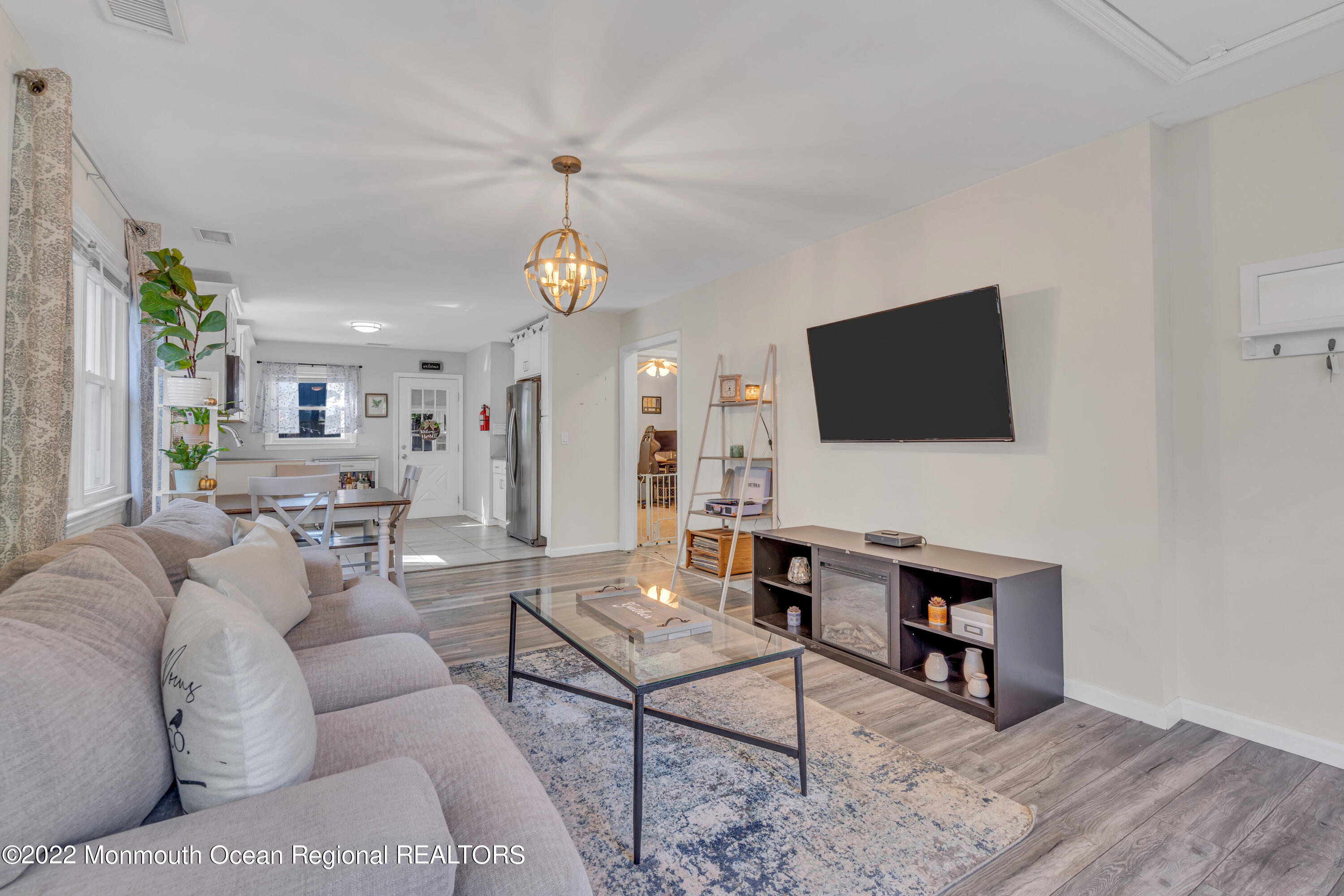 176 Pinehurst Road Brick, NJ 08723 - Photo 8 of 55 a living room with furniture and a flat screen tv