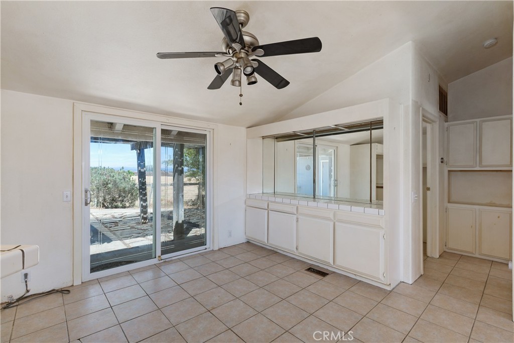 34881 Los Nogales Road Temecula, CA 92592 - Photo 24 of 50 Dining room with cabinetry,tile flooring and access to the back patio area.
