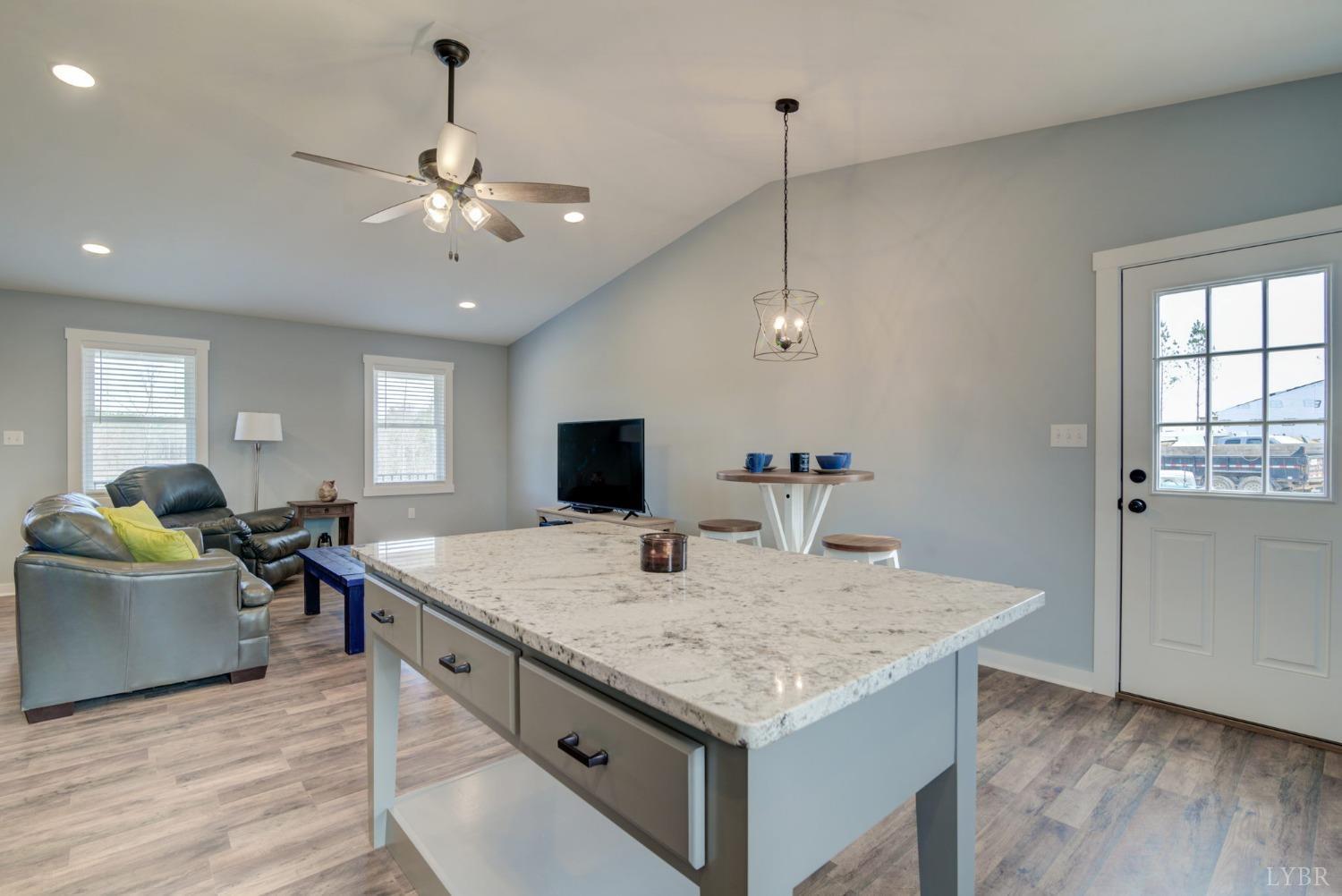 701 Winfall Road Rustburg, VA 24554 - Photo 13 of 38 a living room with stainless steel appliances granite countertop furniture and wooden floor