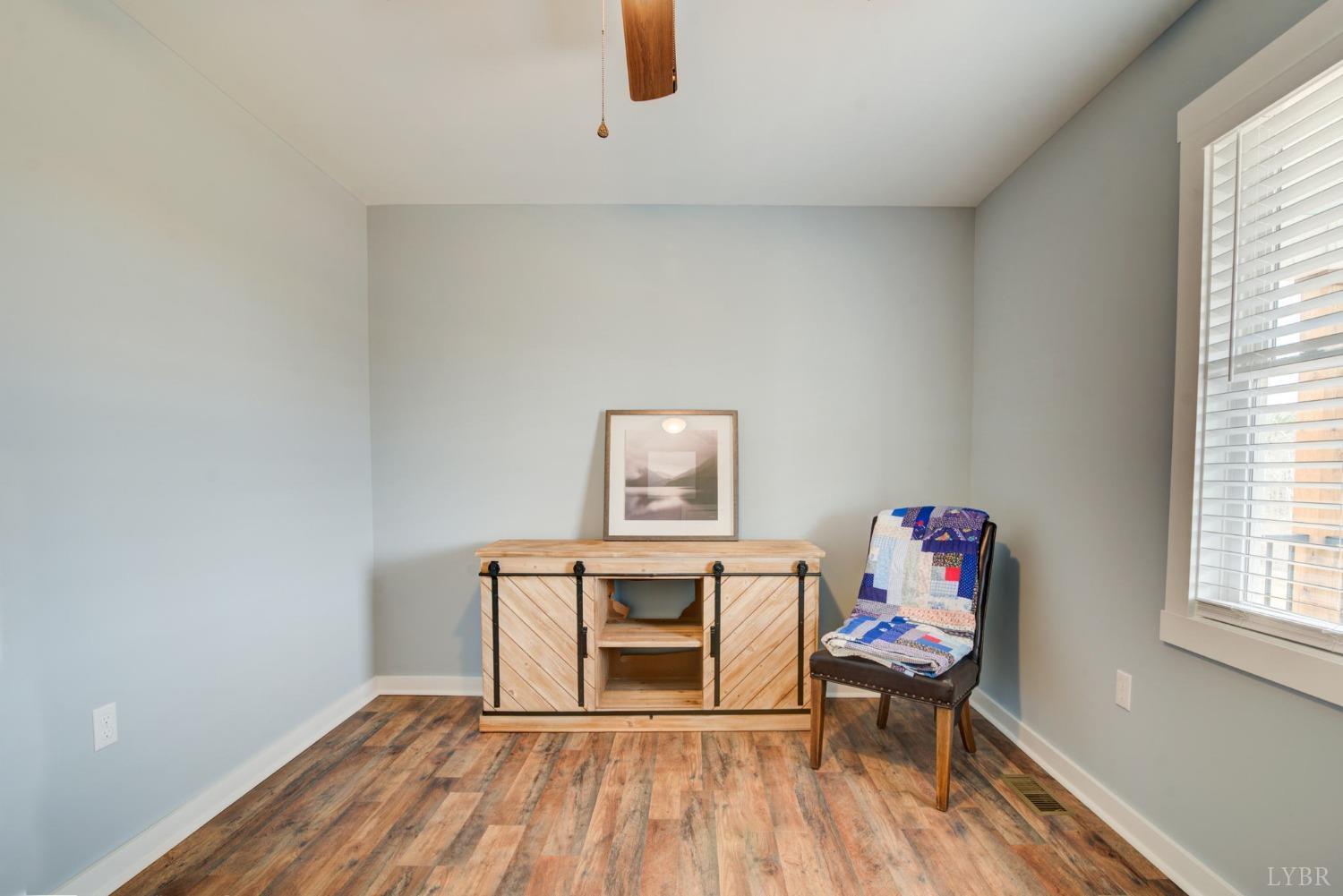701 Winfall Road Rustburg, VA 24554 - Photo 20 of 38 a living room with furniture and a wooden floor