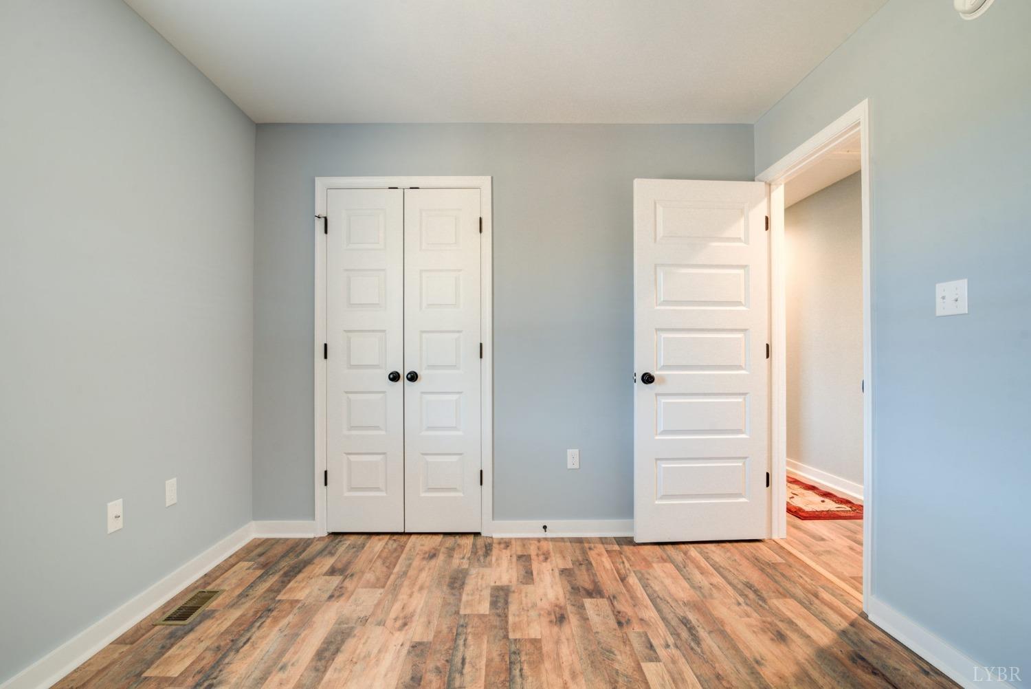701 Winfall Road Rustburg, VA 24554 - Photo 21 of 38 a view of room with window and wooden floor