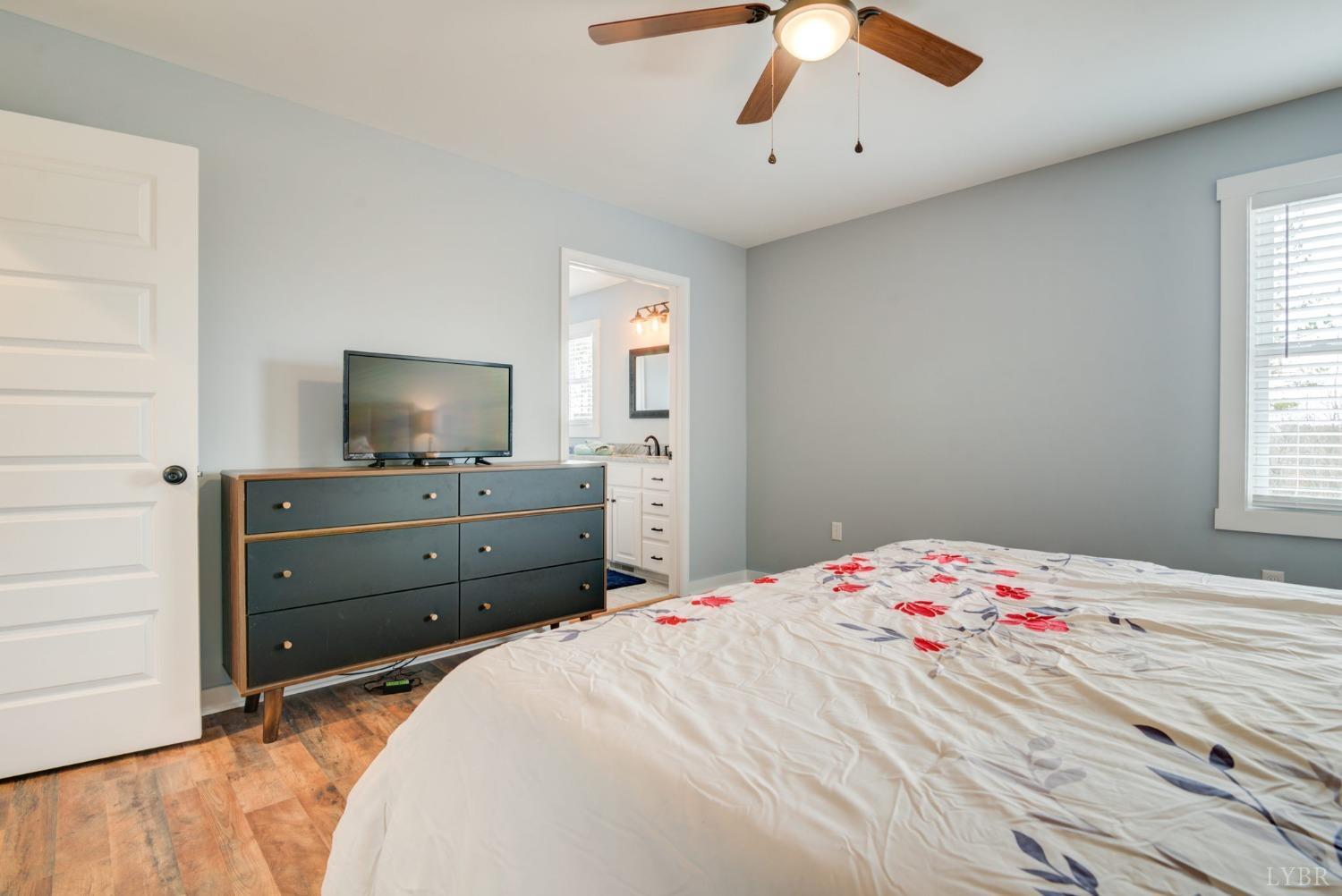 701 Winfall Road Rustburg, VA 24554 - Photo 23 of 38 a bedroom with a bed and a flat screen tv