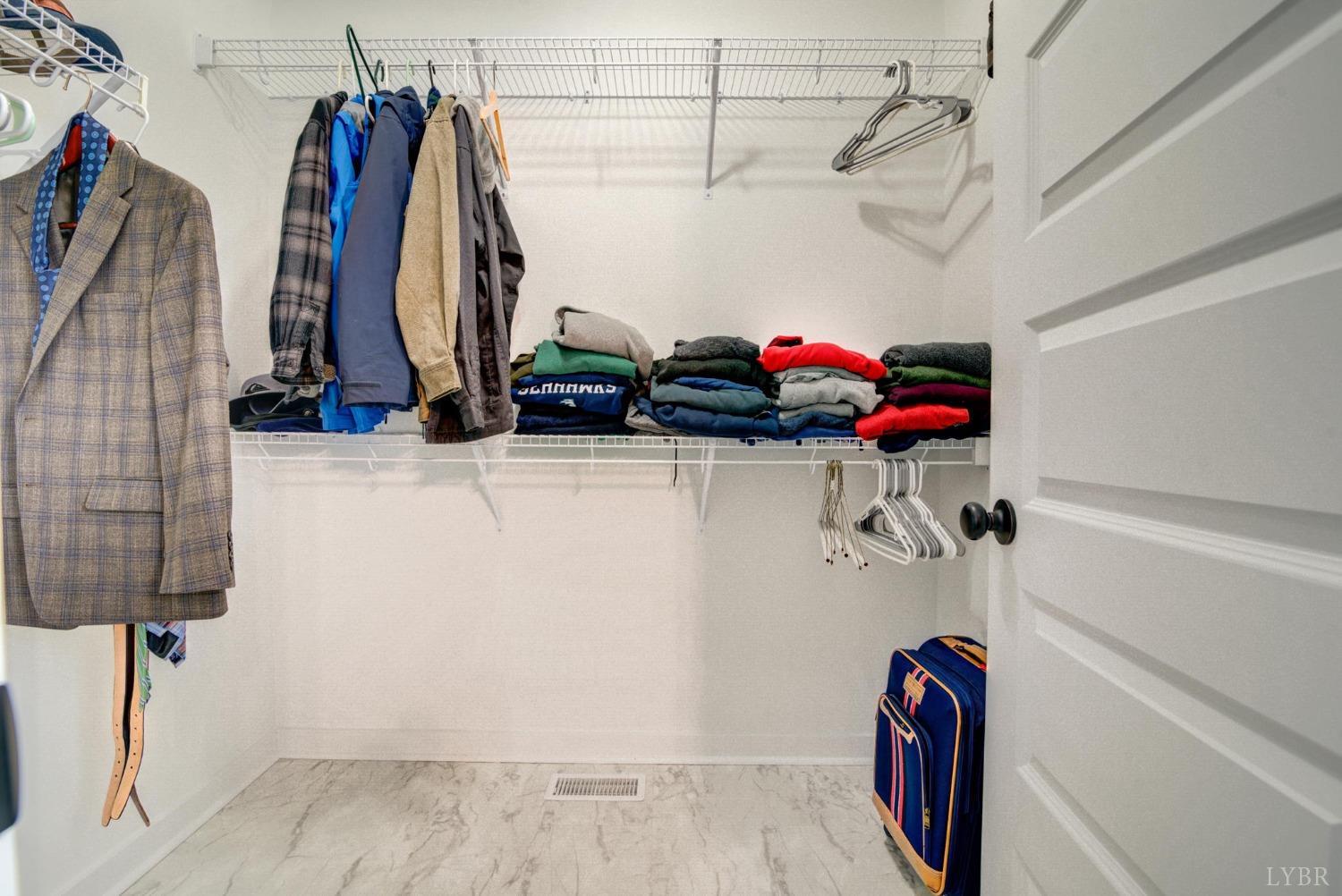 701 Winfall Road Rustburg, VA 24554 - Photo 25 of 38 a view of walk in closet with clothes and shoes