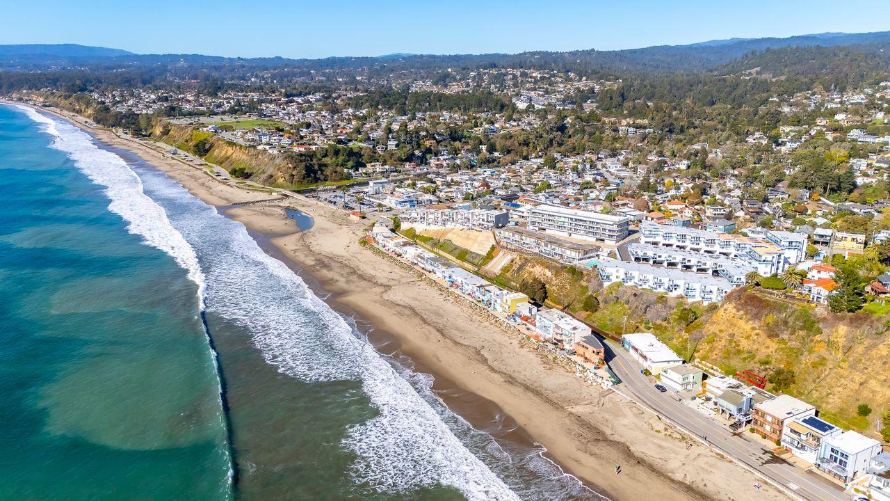 a view of a city with mountains in the background