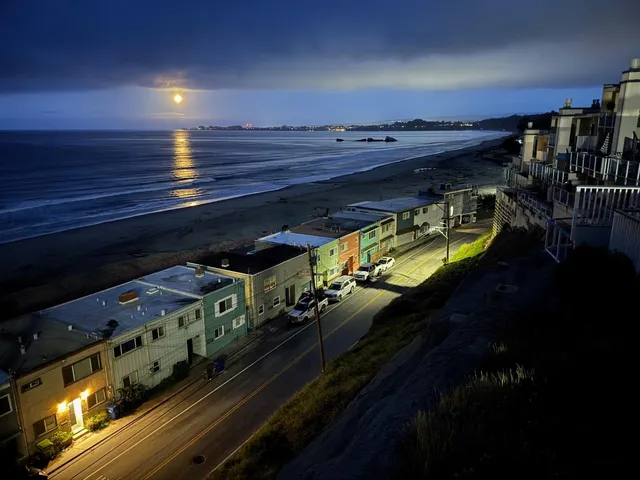 a view of a balcony with chair and wooden floor