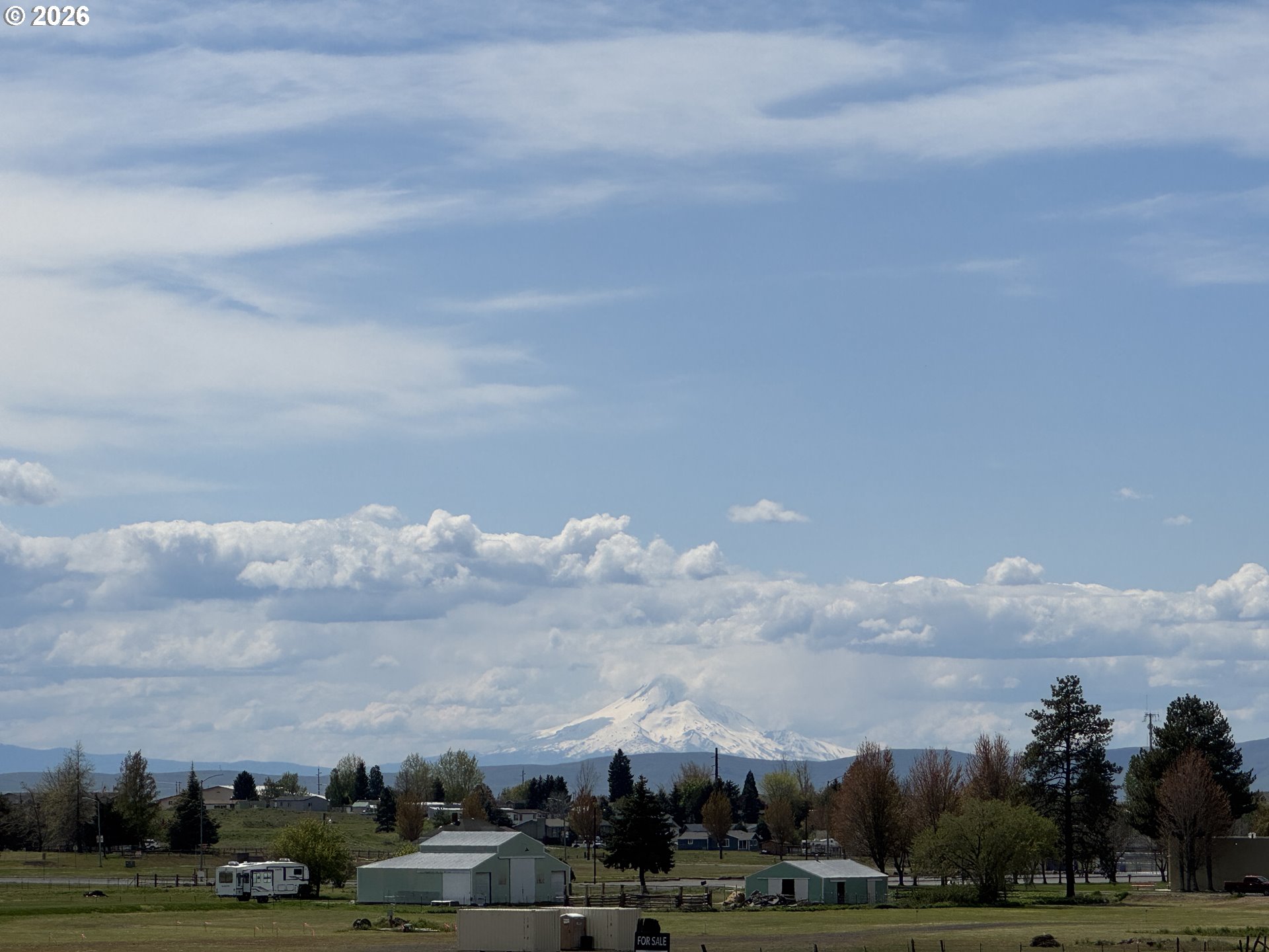 0 East Collins Street Goldendale, WA 98620 - Photo 14 of 15 a view of building with lot of trees in the background