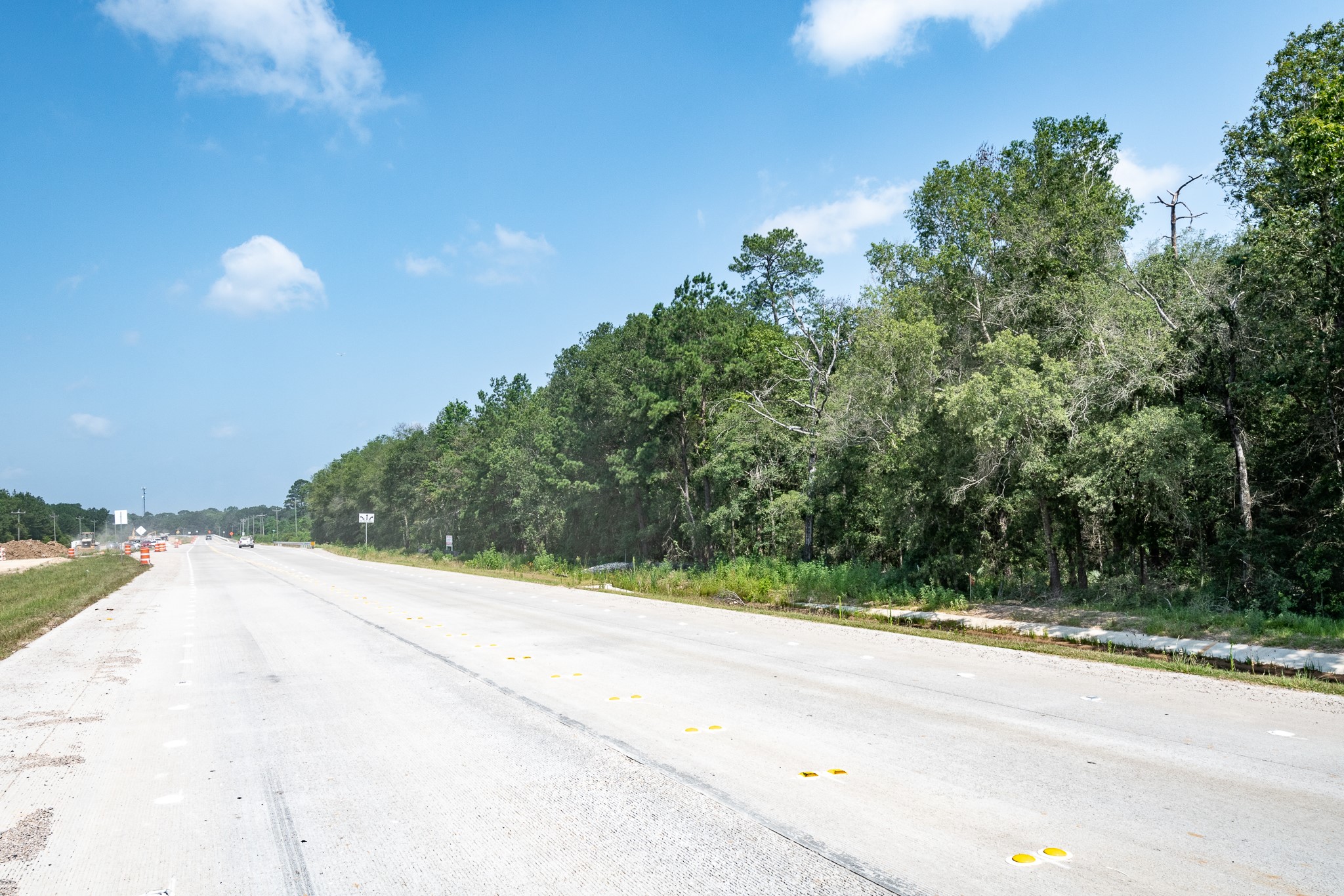 19911 Highway 242 Conroe, TX 77306 - Photo 8 of 9 a view of a road from a yard