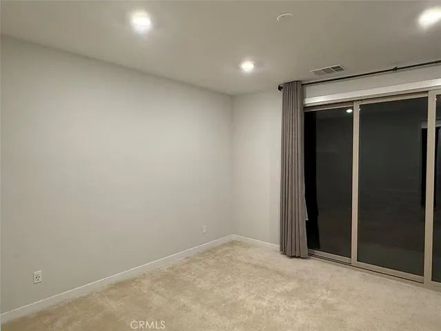an empty room with closet area