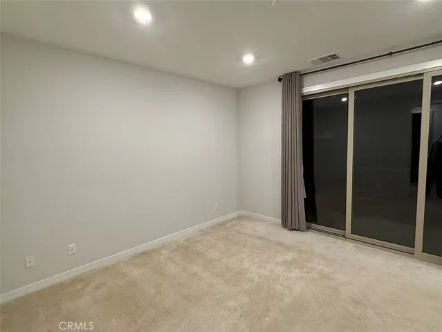 an empty room with closet area