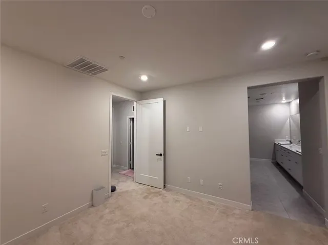 an empty room with a bathroom