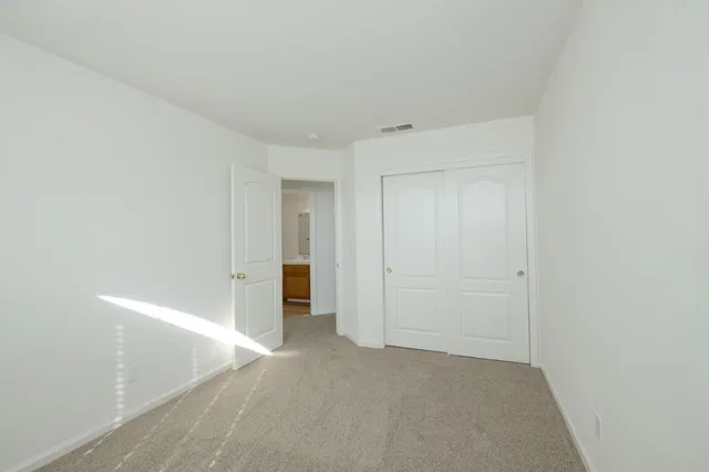 a view of a bathroom from a hallway
