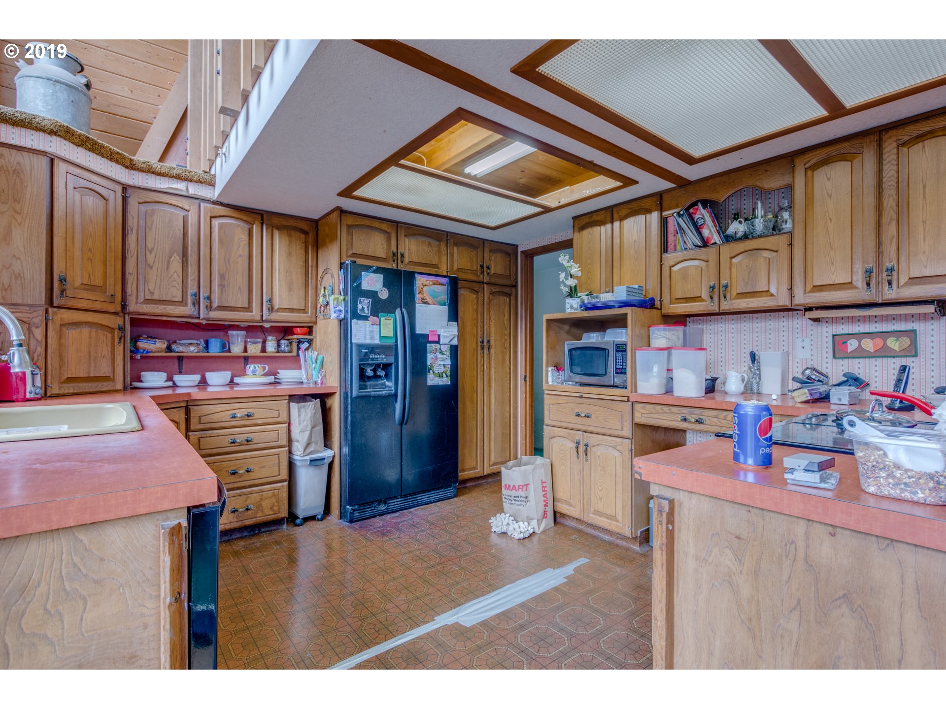 22555 Southeast Bornstedt Road Sandy, OR 97055 - Photo 14 of 32 a kitchen that has a cabinets and refrigerator