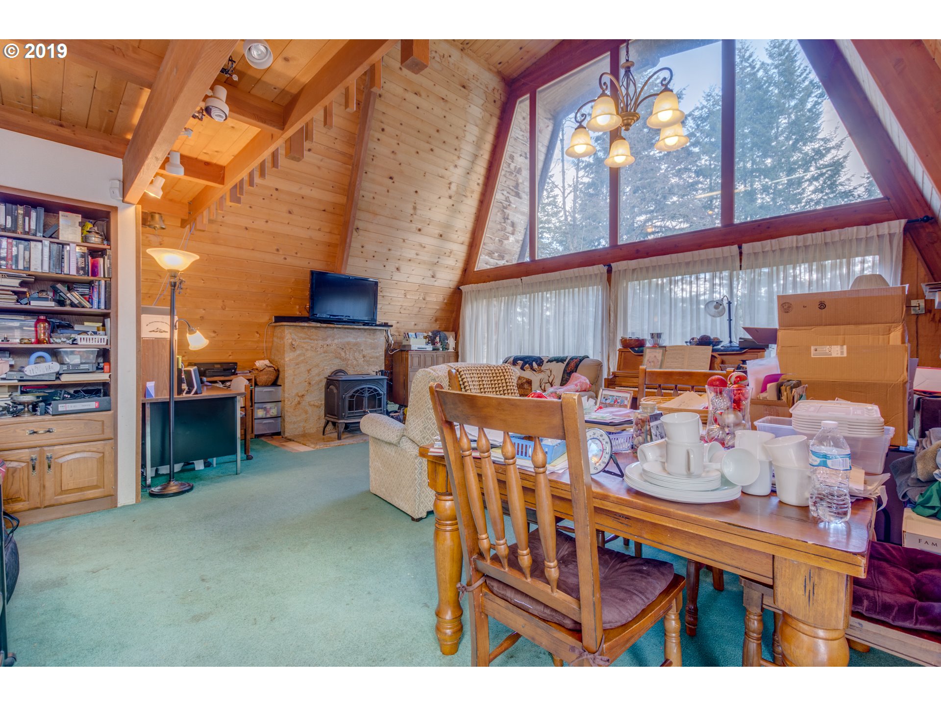 22555 Southeast Bornstedt Road Sandy, OR 97055 - Photo 17 of 32 a dining room with furniture and a floor to ceiling window