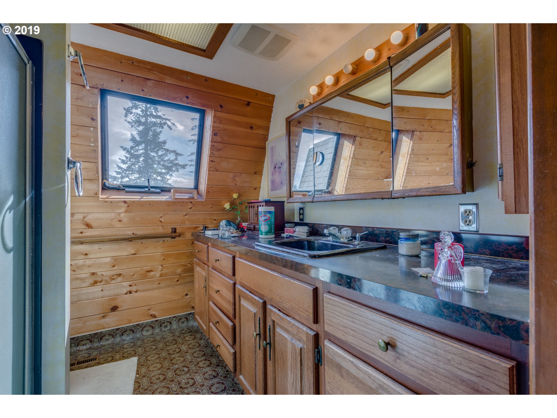 22555 Southeast Bornstedt Road Sandy, OR 97055 - Photo 26 of 32 a bathroom with a sink a mirror and a window