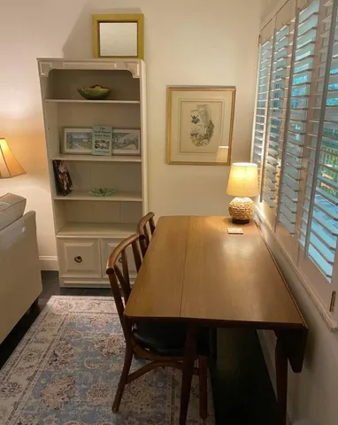 a bedroom with a bed and a table in it