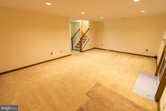 a view of a house with a large window and wooden floor