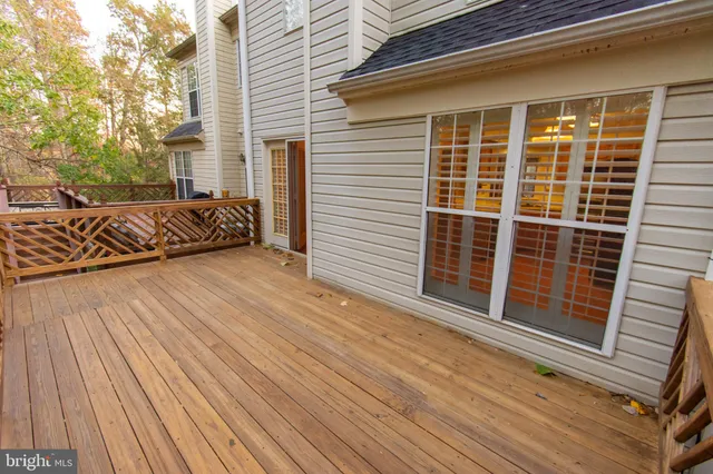 a view of wooden deck and a garden