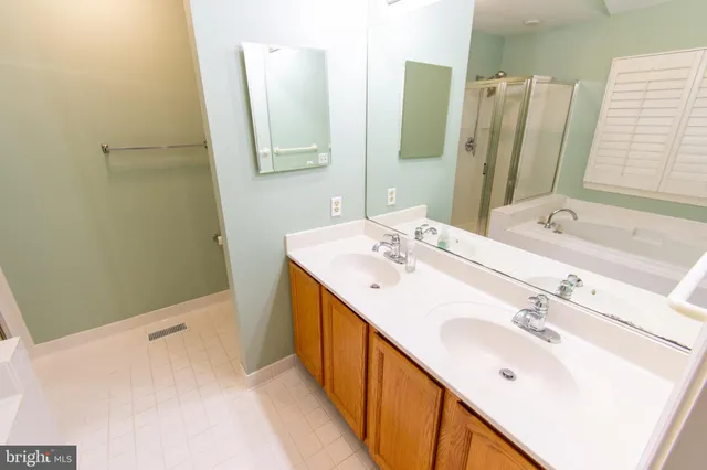 a bathroom with a tub and shower