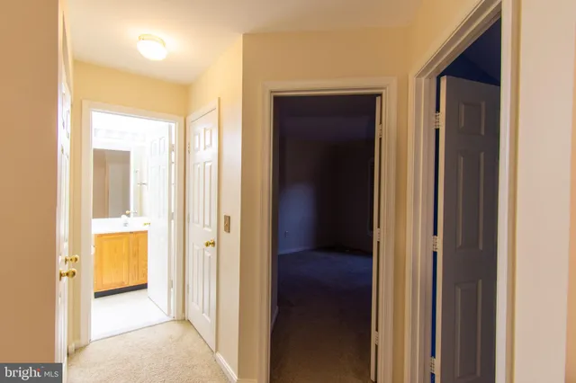 an empty room with windows and entrance